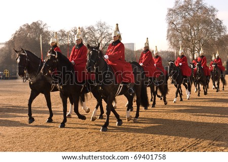 LONDON, UK- JANUARY 19: Members of the Queen\'s Royal Horse Guards, the Royal Life Guards Regiment, riding to the Changing of the Guard Ceremony at Horse Guards Parade. January 19, 2011 in London, UK.