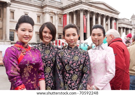 LONDON, UK-FEBRUARY 6: A group of young Chinese woman, dressed for celebrating the annual Chinese New Year with the National Gallery in the background. February 6, 2011 in London, UK.