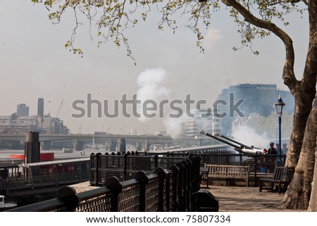 LONDON, UK - APRIL 21: The Honourable Artillery Company fire the 62 round Gun Salute, for the Queen\'s birthday at the Tower of London. Cannon fire across the River Thames.April 21, 2011 in London UK.