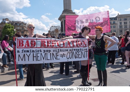 LONDON, UK- JUNE 11: Unidentified woman hold a banner at Slut Walk and rally on June 11, 2011 in Trafalgar Square, London, UK. The woman are demanding the right to wear what they like without harassment.