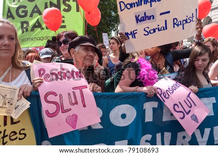 LONDON, UK- JUNE 11: Unidentified woman hold a banner at Slut Walk and rally on June 11, 2011 in Piccadilly, London, UK. The woman are demanding the right to wear what they like without harassment.