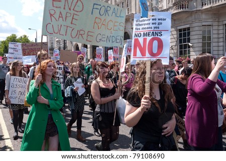 LONDON, UK- JUNE 11: Unidentified woman hold a banner at Slut Walk and rally on June 11, 2011 in Piccadilly, London, UK. The woman are demanding the right to wear what they like without harassment,