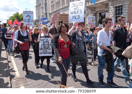 LONDON, UK- JUNE 11: Unidentified woman hold a banner at Slut Walk and rally on June 11, 2011 in Piccadilly, London, UK. The woman are demanding the right to wear what they like without harassment.
