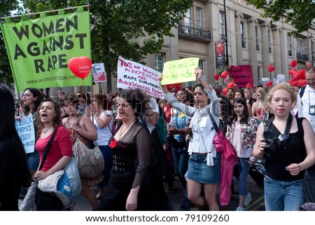 LONDON, UK- JUNE 11: Unidentified woman hold a banner at Slut Walk and rally on June 11, 2011 Trafalgar Square, London, UK. The woman are demanding the right to wear what they like without harassment