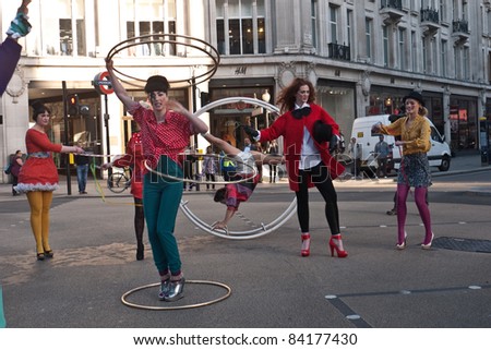 LONDON, UK-SEPTEMBER 5:Early morning traffic came to a standstill at Oxford Circus as a spectacular circus themed fashion shoot  promoted High Street Fashion Week,. September 5,2011 in London UK