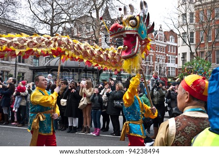 LONDON, UK-JANUARY 29: Chinese Dragon dancers take to the streets in a parade, part of the famous London celebrations for the year of the dragon, January 29, 2012 in London UK