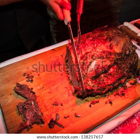 Carving Table with a Red Heat Lamp Warming the Meat