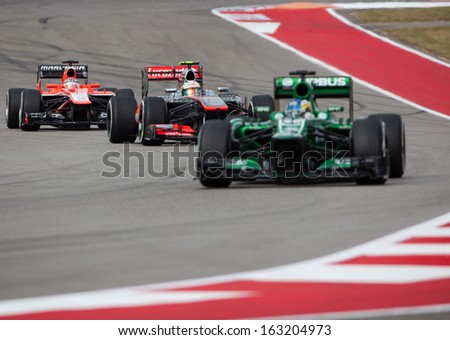 Austin, Texas Ã¢Â?Â? November 16. Three Formula 1 Cars Entering Turn 13 In The Formula One Qualifying Session At The Circuit Of The America\'S Race Track On November 16, 2013 In Austin, Texas.