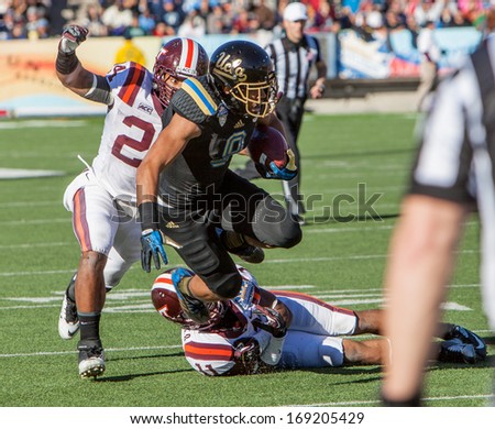 EL PASO, TEXAS - DECEMBER 31.  UCLAÃ¢Â?Â?a Payton (9) being tackled by Barr (11) and Adams (24) of Virginia Tech at the Sun Bowl on December 31, 2013 in El Paso, Texas.