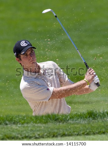 CROMWELL, CT - JUNE 21: Golfer Chris Stroud chips out of the sand trap at hole 5 at the Travelers Championship at TPC River Highlands Golf Course on June 21, 2008 in Cromwell, CT
