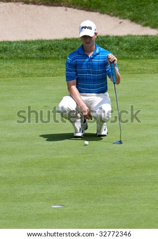 CROMWELL, CT - JUNE 27: Golfer Chris Stroud lining up his putt on the 18th green at the Travelers Championship at TPC River Highlands Golf Course on June 27, 2009 in Cromwell, CT.