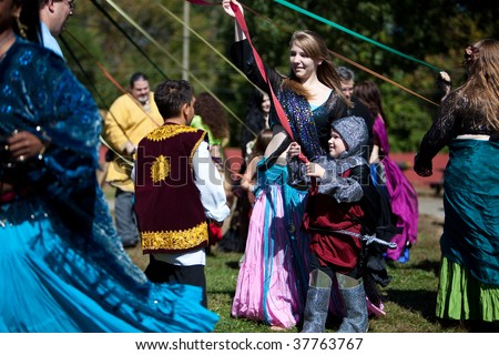 HEBRON, CT - SEPTEMBER 26:  Opening day of the Connecticut Renaissance Faire, people young and old dance around a May pole at the Renaissance Faire on September 26, 2009 in Hebron, CT.