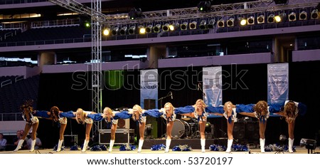 DALLAS - MAY 17.  Dallas Cowboys Cheerleaders perform routines for the American Association of Airport Executives convention held at the Cowboys Stadium on May 17, 2010 at Dallas, Texas.