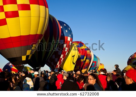 ALBUQUERQUE - OCTOBER 10:  Crowds watch as balloons inflate during the Farewell Mass Ascension at the Albuquerque International Balloon Fiesta the morning of October 10, 2010 in Albuquerque, NM.