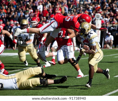 EL PASO – DECEMBER 31:  UTAH's Bird (35) is about to tackle Georgia Tech's Schroer (14) during UTAH's overtime 30 to 27 win over Georgia Tech at the Sun Bowl on December 31, 2011 in El Paso, Texas.
