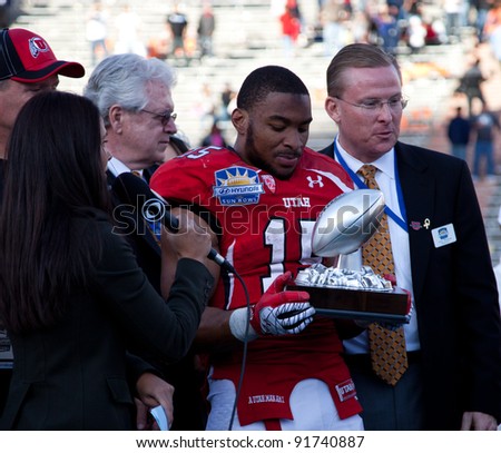 EL PASO – DECEMBER 31:  DeVonte Christopher is presented with the John Folmer Most Valuable Special Teams Player trophy at the Sun Bowl on December 31, 2011 in El Paso, Texas.