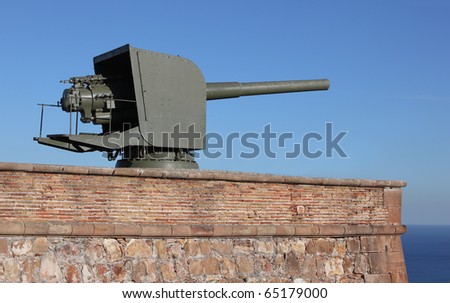 Turret mounted artillery gun in old fortifications