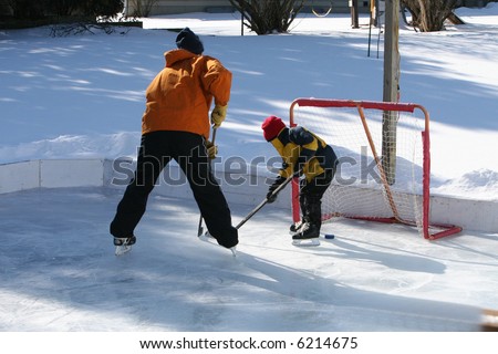 Playing ice hockey on an outdoor ice rink