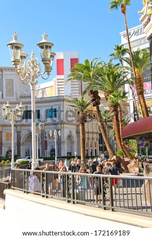 LAS VEGAS, NEVADA, USA - OCTOBER 20, 2013 : Tourists on the Strip  in Las Vegas, Nevada.  40 million tourists visited Las Vegas in 2012