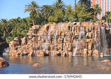 LAS VEGAS, NEVADA, USA - OCTOBER 21, 2013 : Waterfall at Treasure Island hotel and casino  in Las Vegas, This Caribbean themed resort has an hotel with 2,884 rooms