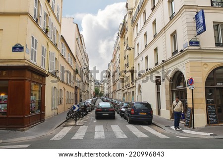 PARIS, FRANCE - JULY 10, 2012: Pedestrian on  street rue de Grenelle in Paris
