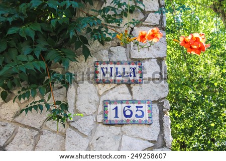 Bellaria Igea Marina, Rimini, Italy - August 14, 2014: Colorful signboard with number on the house in the resort town Bellaria Igea Marina, Rimini