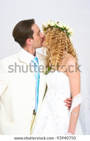 stock photo Young couple posing in a studio on the wedding day
