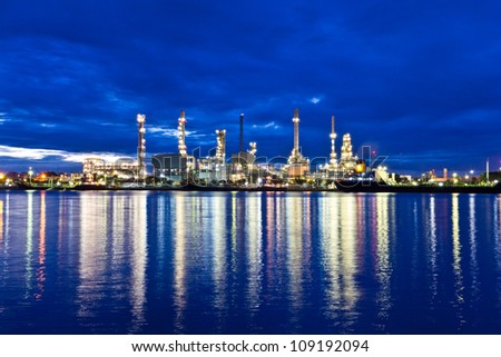 Oil refinery plant at twilight morning along river in Bangkok