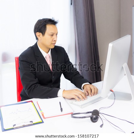 business man working with desktop computer