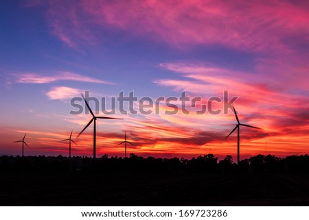 silhouette wind turbine with dusk clean energy concept