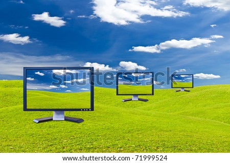 Lcd monitor on green grass meadow
