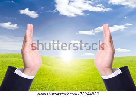 business man hand in new day, conceptual of nature care