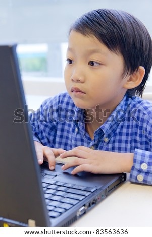 asian kid with laptop notebook
