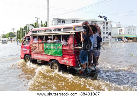 BANGKOK-NOV 08 : local bus on water flooded road. Nov 08, 2011, Thailand , Bangkok, panya road and prayasuren road intersection