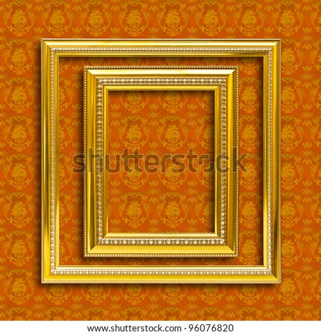 frame of golden wood  on yellow wallpaper