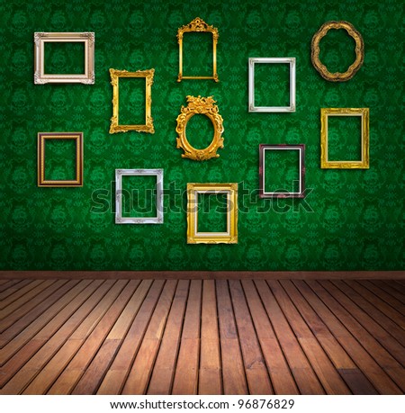 vintage frame in green wallpaper room