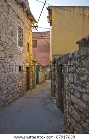 Old stony street on island Krapanj, the smallest inhabited island of the Adriatic sea. It is also the most densely inhabited island and has the lowest elevation of 1.5 m above sea level.