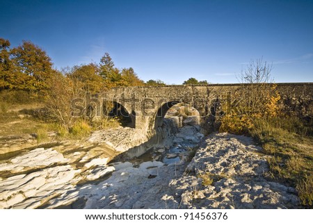 Old stony bridge and the brook