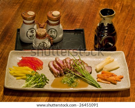 Delicious Japanese dish (duck breast) stalled on a table in a Japanese restaurant