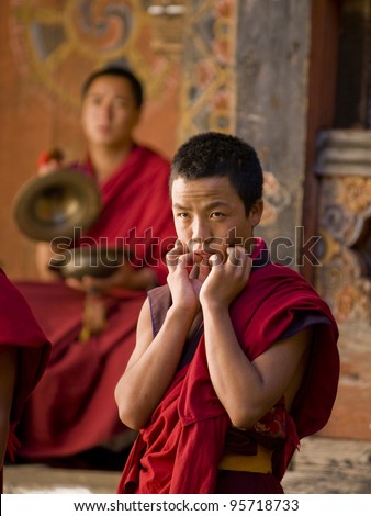 JAKAR, BHUTAN - OCTOBER 23, 2010: Monks rehearsing for the Jakar tsechu which is held the next day on Oct. 23, 2010 in Jakar. Tsechu are annual religious Bhutanese festivals usually around October
