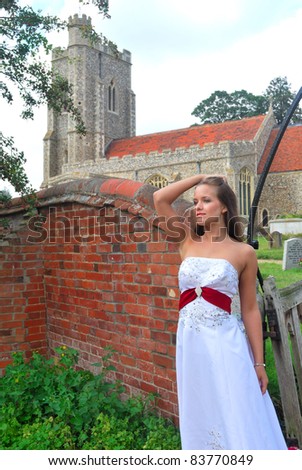bride in white dress outside church