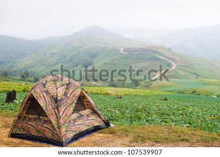 Landscape of camping tent on the top of mountain in the morning fog at Thailand