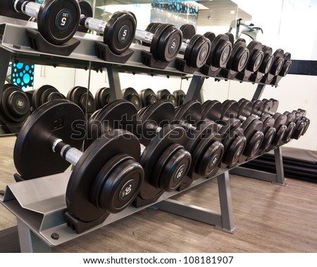 Weights,  many black dumbbell in fitness room