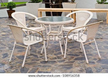 basketry chairs set on the slate stone decorative floor.
