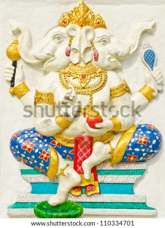 God of success 28 of 32 posture. Indian style or Hindu God Ganesha avatar image in stucco low relief technique with vivid color,Wat Samarn, Chachoengsao,Thailand.