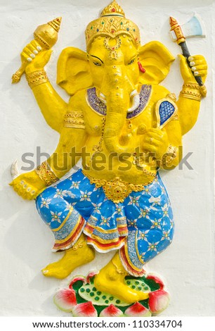 God of success 31 of 32 posture. Indian style or Hindu God Ganesha avatar image in stucco low relief technique with vivid color,Wat Samarn, Chachoengsao,Thailand.