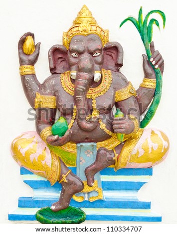 God of success 2 of 32 posture. Indian style or Hindu God Ganesha avatar image in stucco low relief technique with vivid color,Wat Samarn, Chachoengsao,Thailand.