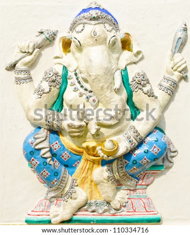 God of success 22 of 32 posture. Indian style or Hindu God Ganesha avatar image in stucco low relief technique with vivid color,Wat Samarn, Chachoengsao,Thailand.