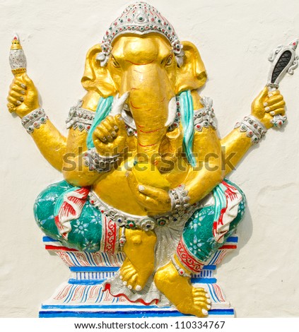 God of success 20 of 32 posture. Indian style or Hindu God Ganesha avatar image in stucco low relief technique with vivid color,Wat Samarn, Chachoengsao,Thailand.