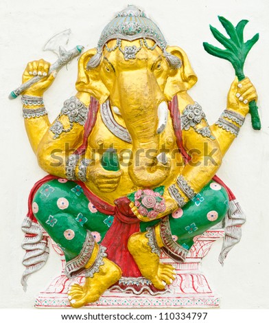 God of success 7 of 32 posture. Indian style or Hindu God Ganesha avatar image in stucco low relief technique with vivid color,Wat Samarn, Chachoengsao,Thailand.